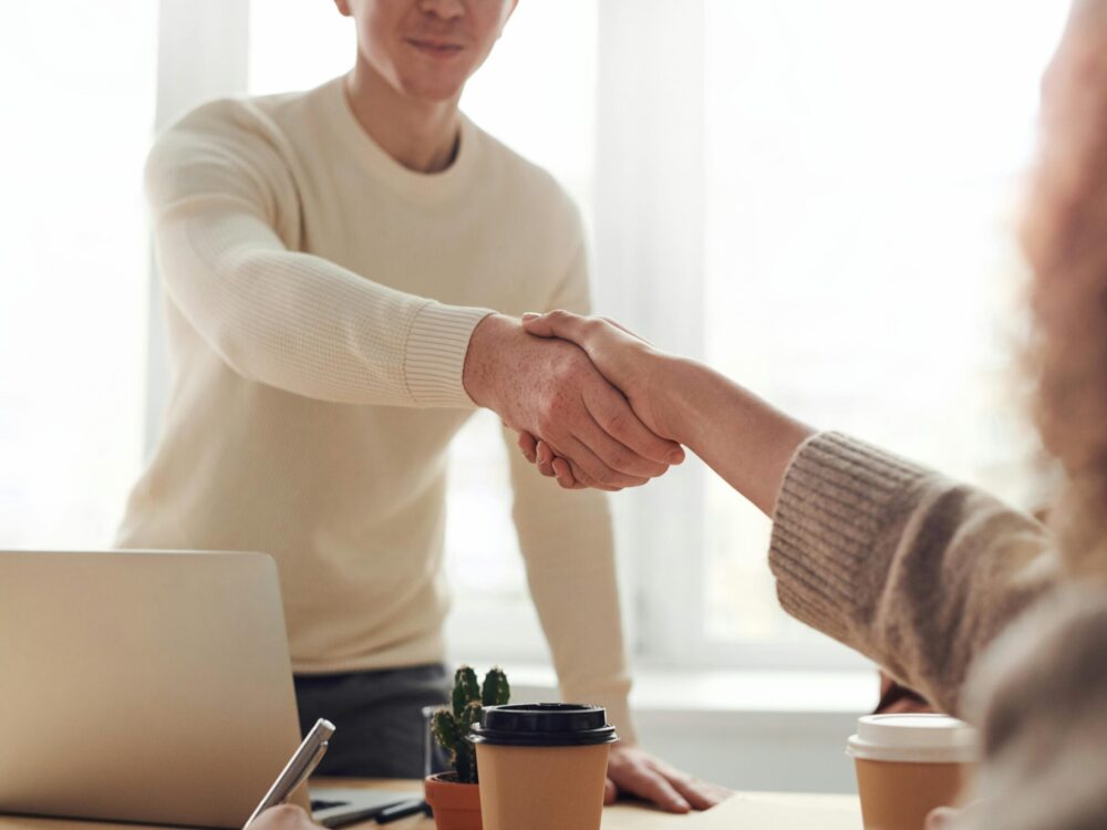 Shows to people shaking hands