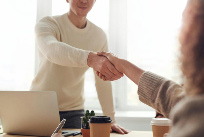 Shows to people shaking hands