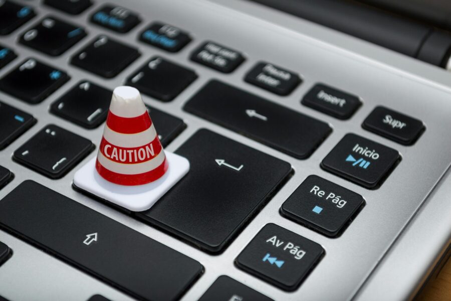 This image shows a small caution bollard on the return key of a keyboard